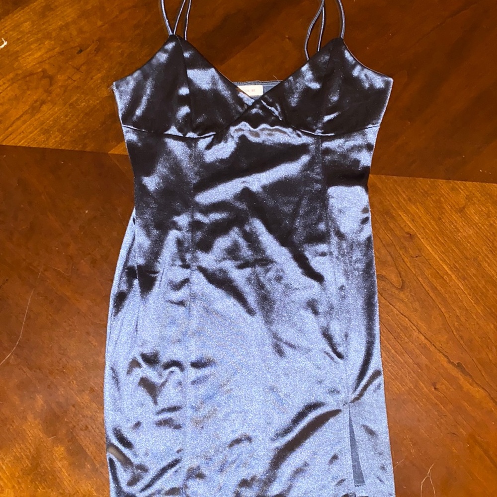navy blue slip dress, with small slit at the bottom. satin material